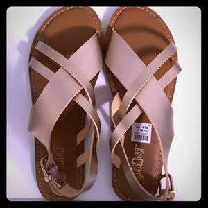 Brand new women’s Gold size 8.5 gladiator sandals